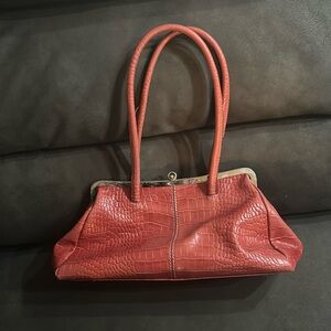 Smaller, red, shoulder bag.